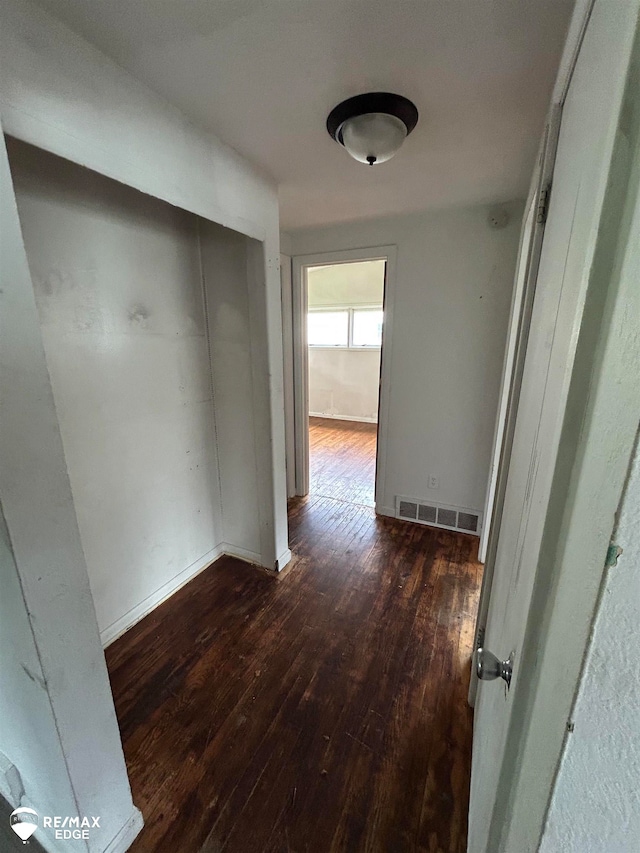 hall with dark hardwood / wood-style floors