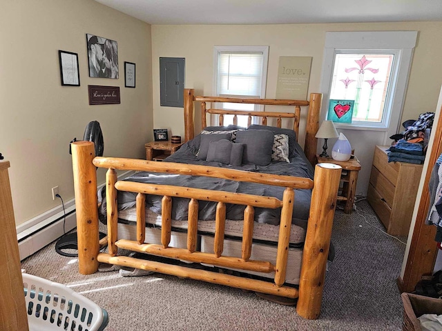 carpeted bedroom with electric panel and a baseboard heating unit