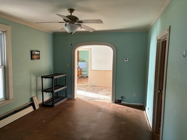 empty room with baseboard heating, ceiling fan, and ornamental molding