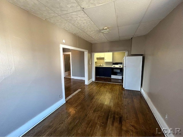 interior space with dark hardwood / wood-style floors and white appliances