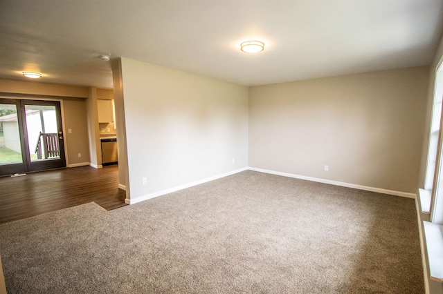 spare room featuring dark hardwood / wood-style floors