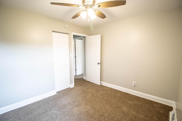 unfurnished bedroom with ceiling fan, carpet floors, and a closet