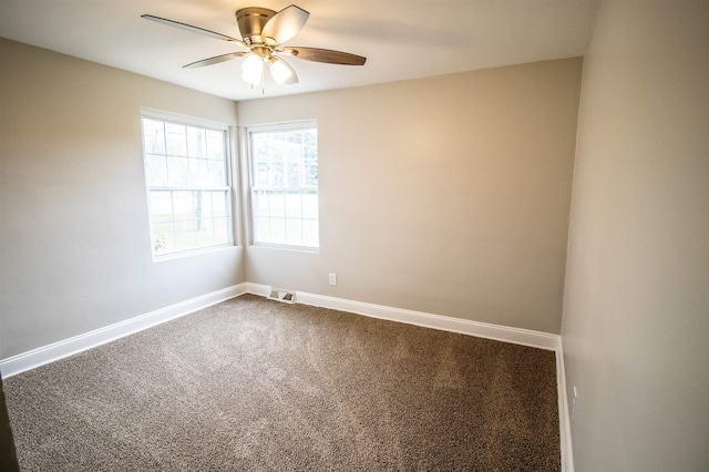 unfurnished room with ceiling fan and carpet flooring