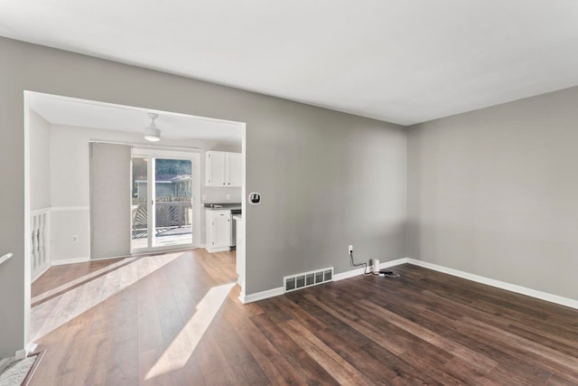 empty room featuring dark hardwood / wood-style flooring