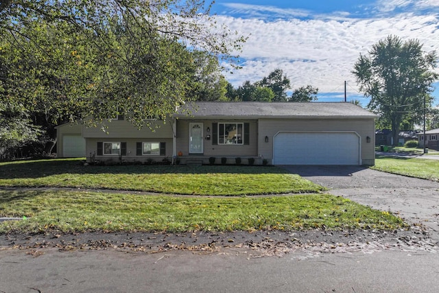 view of front of house with a garage and a front lawn