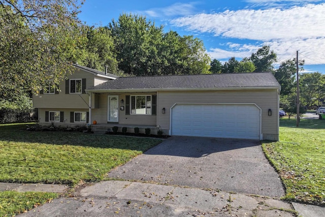 tri-level home featuring a garage and a front lawn