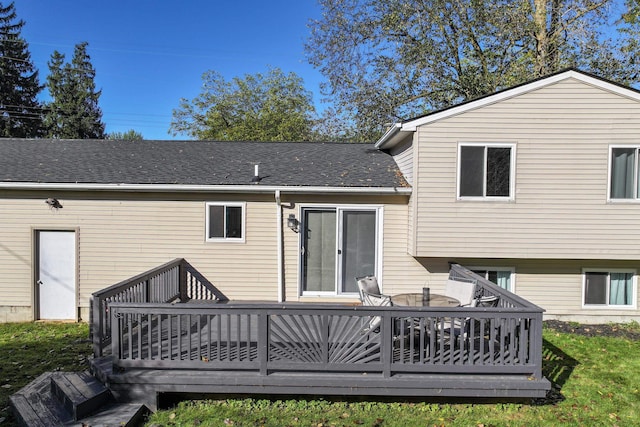 rear view of house featuring a deck