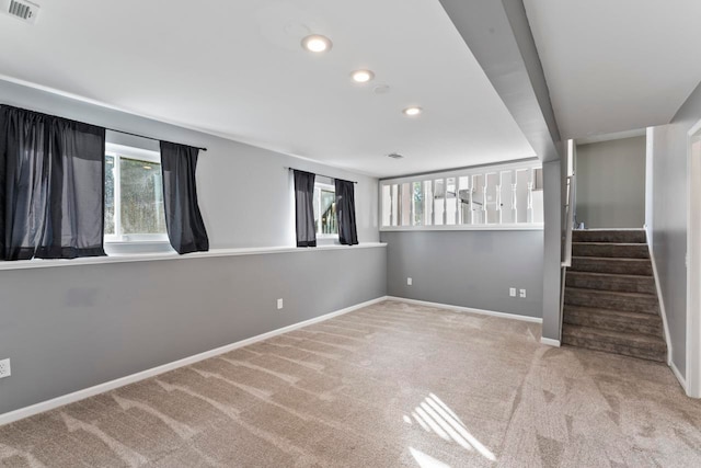 carpeted empty room featuring a healthy amount of sunlight