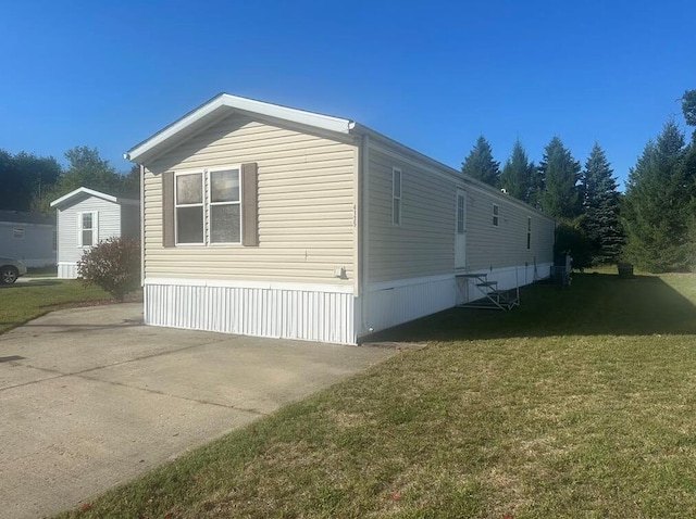 view of property exterior with a lawn