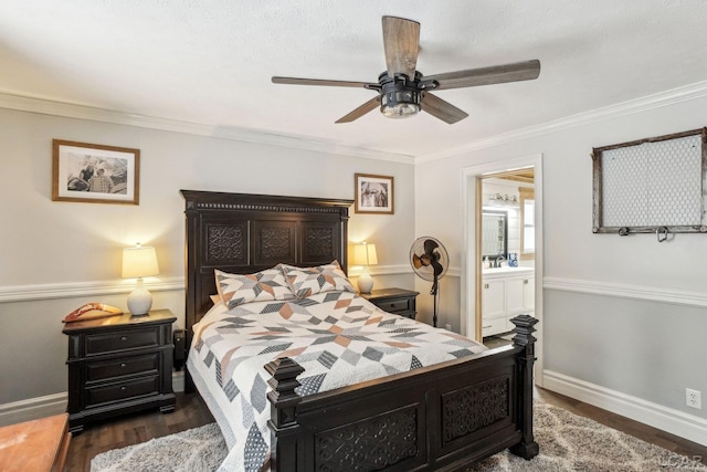 bedroom with crown molding, ceiling fan, dark hardwood / wood-style floors, and ensuite bath