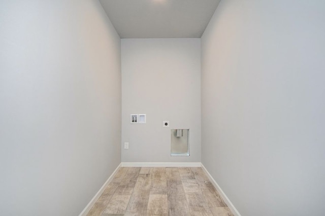 clothes washing area with hookup for an electric dryer, light hardwood / wood-style floors, and hookup for a washing machine