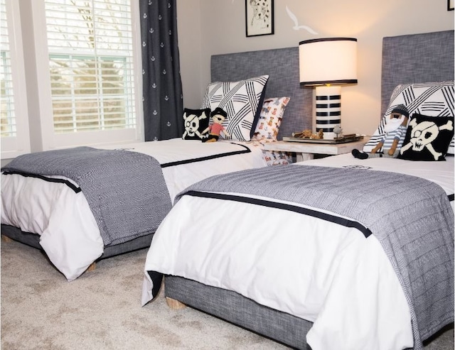 bedroom with light colored carpet