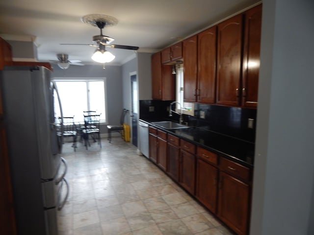 kitchen featuring backsplash, stainless steel dishwasher, ceiling fan, sink, and white refrigerator