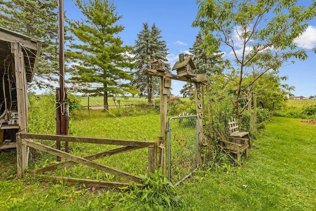 exterior space featuring a rural view and a lawn