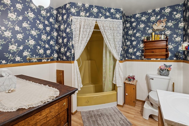 full bathroom with shower / bathtub combination with curtain, vanity, toilet, and wood-type flooring