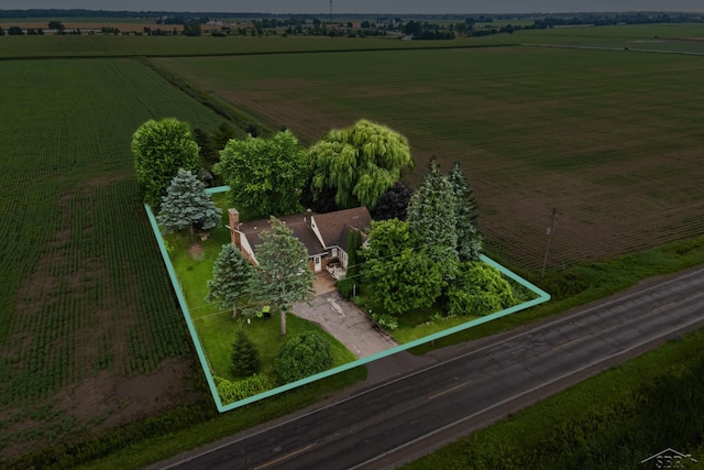 birds eye view of property with a rural view