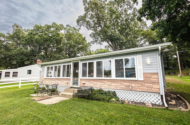 482 Swan Ln, Coldwater, MI 49036 - rear view of house with a lawn