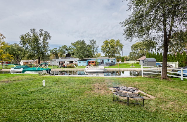 482 Swan Ln, Coldwater, MI 49036 - view of community featuring a water view, a fire pit, and a lawn