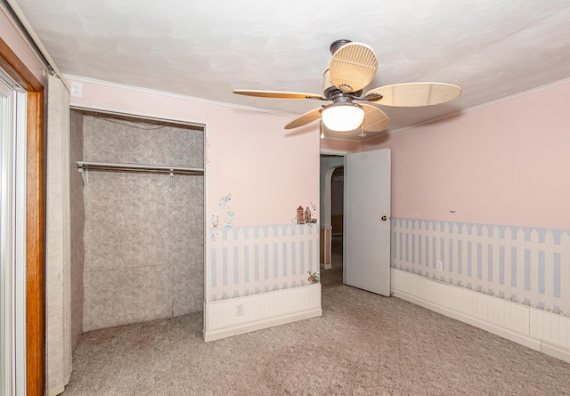 482 Swan Ln, Coldwater, MI 49036 - unfurnished bedroom featuring a closet, crown molding, carpet, and ceiling fan