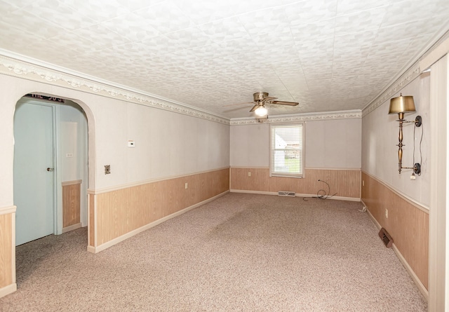 482 Swan Ln, Coldwater, MI 49036 - spare room featuring carpet floors, ceiling fan, and wooden walls