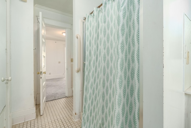 bathroom featuring tile patterned flooring and ornamental molding