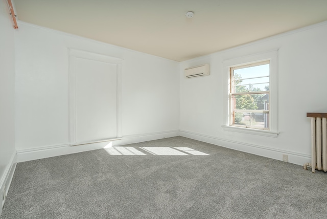 unfurnished room featuring carpet, radiator heating unit, and an AC wall unit