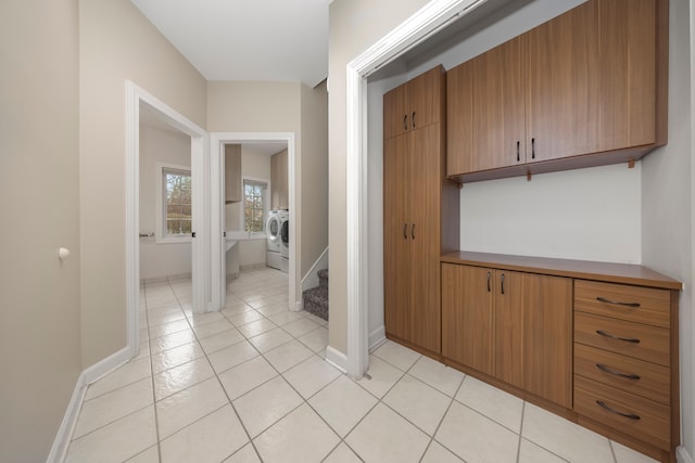 interior space with washer / clothes dryer and light tile patterned flooring