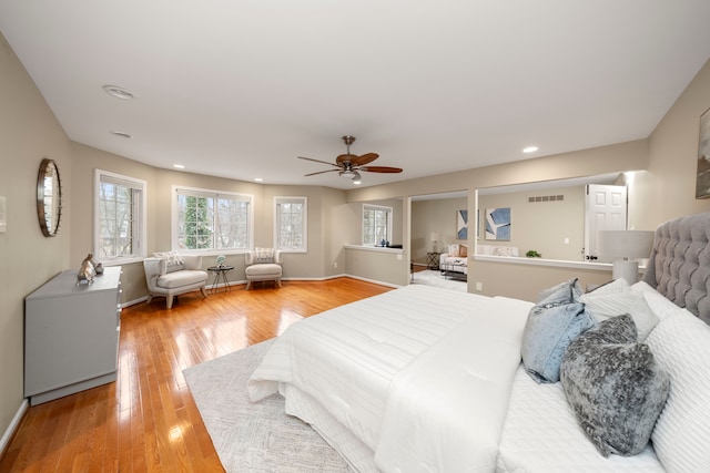 bedroom with hardwood / wood-style flooring and ceiling fan