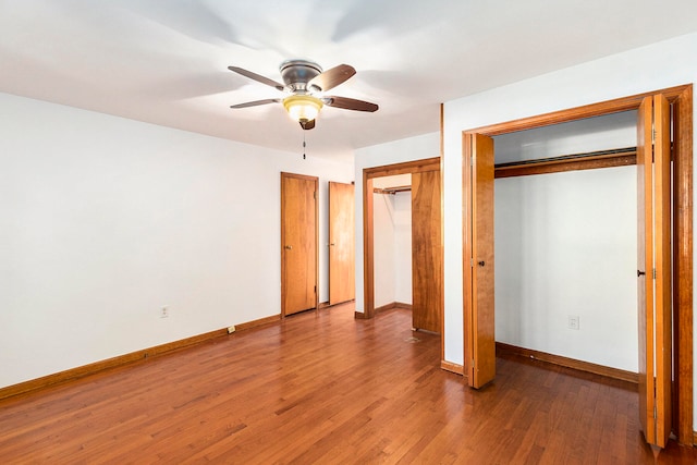 unfurnished bedroom featuring wood-type flooring and ceiling fan