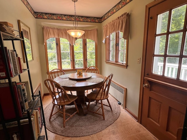 dining area featuring radiator heating unit