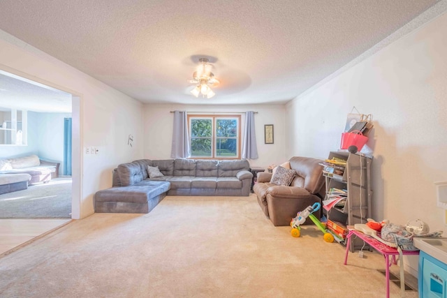 carpeted living room featuring a textured ceiling and ceiling fan