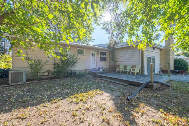 view of front of home with cooling unit and a deck