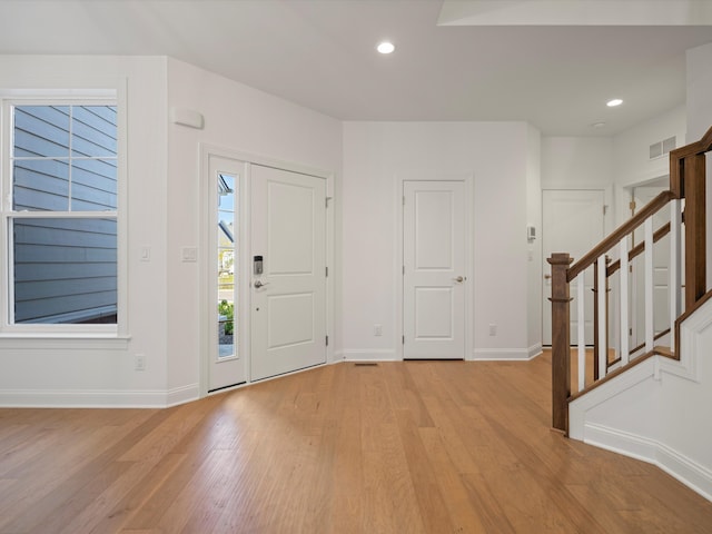 foyer entrance with light wood-type flooring