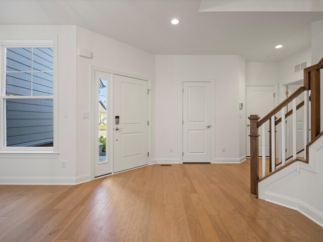 3318 Roseford Blvd, Ann Arbor, MI 48105 - entryway featuring light wood-type flooring, stairs, baseboards, and recessed lighting
