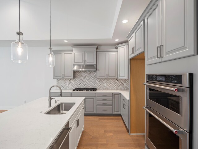 3318 Roseford Blvd, Ann Arbor, MI 48105 - kitchen featuring gray cabinetry, stainless steel appliances, a sink, recessed lighting, and under cabinet range hood