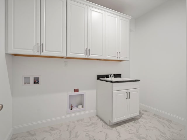 laundry room featuring cabinets, sink, and washer hookup