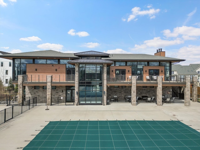 rear view of property featuring a patio