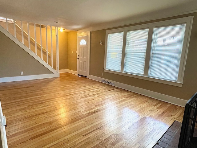 unfurnished living room with light hardwood / wood-style floors