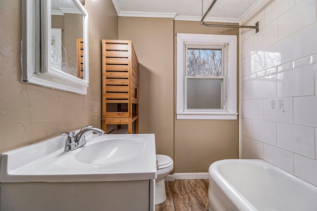 full bathroom with vanity,  shower combination, crown molding, wood-type flooring, and toilet