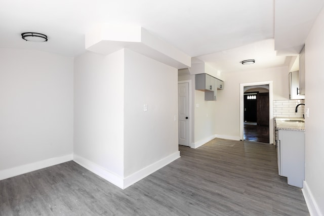 interior space with sink and dark wood-type flooring