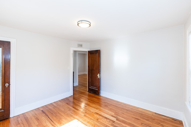 spare room featuring light wood-type flooring