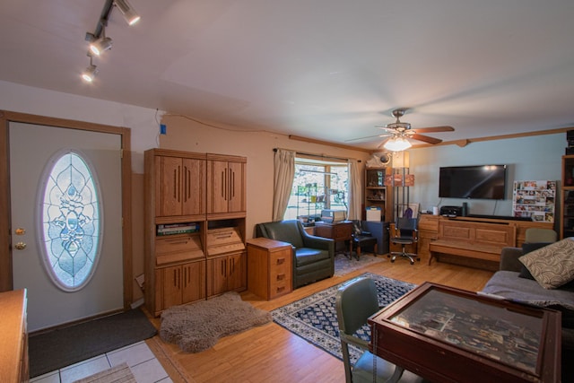 living room with ceiling fan, light wood-type flooring, and rail lighting