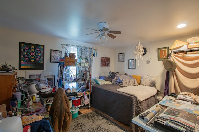 bedroom with ceiling fan and hardwood / wood-style floors