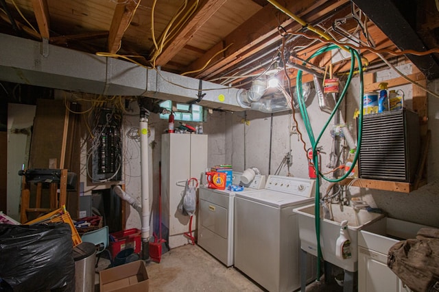 clothes washing area with washing machine and clothes dryer