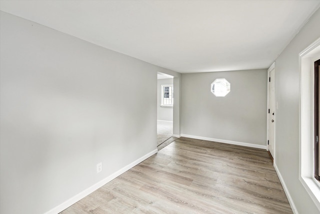 spare room featuring light wood-type flooring