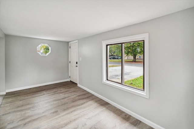 empty room with light wood-type flooring