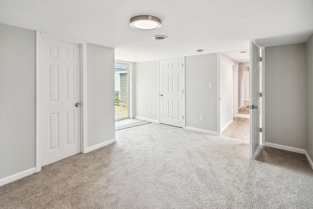 unfurnished bedroom featuring access to outside and light colored carpet