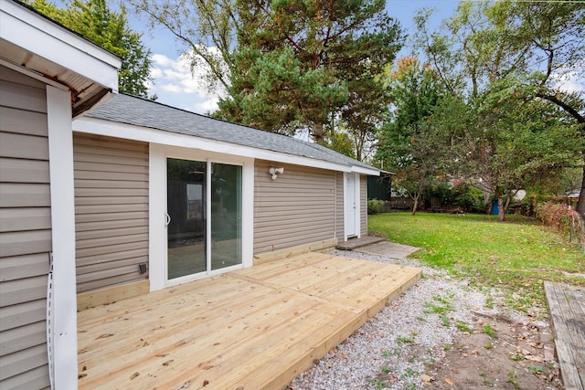 wooden terrace with a lawn