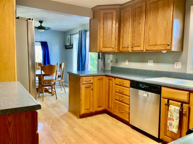 kitchen featuring appliances with stainless steel finishes, light wood-type flooring, a wealth of natural light, and ceiling fan