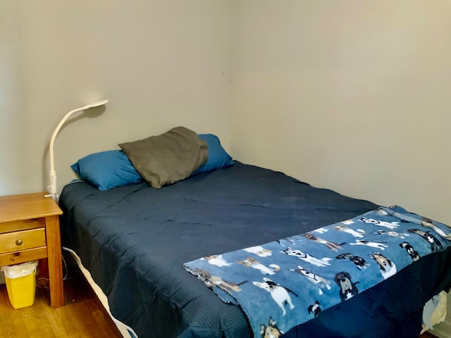 bedroom with wood-type flooring